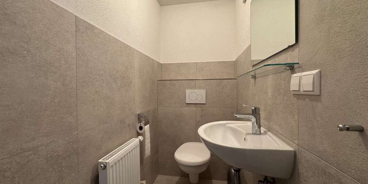 Investieren im Silberstreifen: Wohn-Gewerbeimmobilie mit Garten, Garage & Flexibilitä - Gewerbeobjekt Rheinstetten | Angebot:20367430